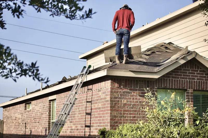Professional roofer working on a residential roof in Downtown St. Petersburg